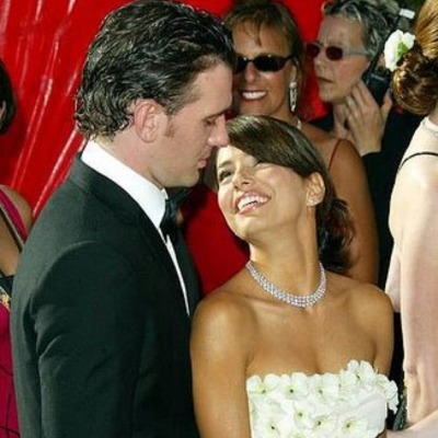 JC Chasez and his former girlfriend, Eva Longoria, looking at each other.